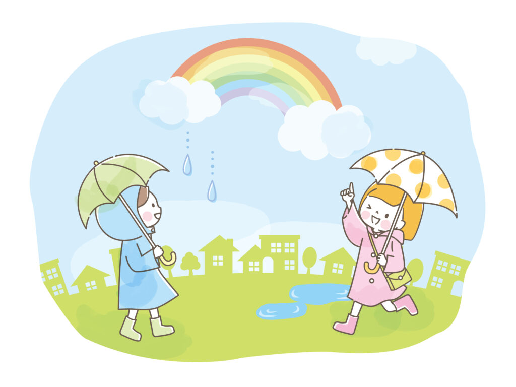 雨上がりの虹と子供たち